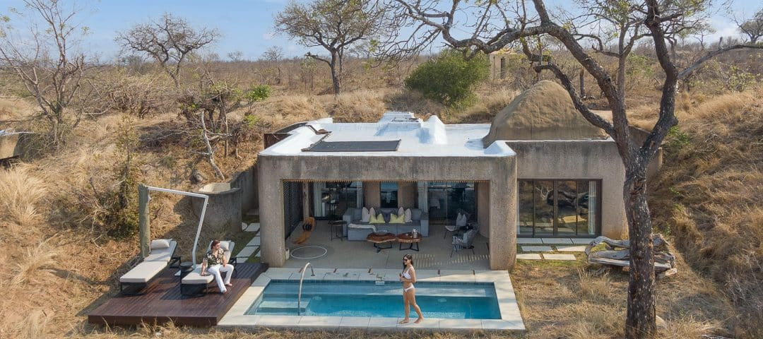 Luxury safari lodge suite with a private plunge pool and outdoor lounge area, blending modern design with the natural landscape of the African bush. This high-end glamping experience highlights key insights from Sage Outdoor Advisory’s feasibility studies on outdoor hospitality trends.