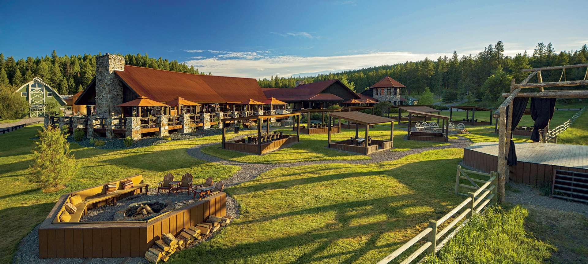 Expansive glamping resort with fire pit, dining pavilions, and rustic architecture—used in Sage Outdoor Advisory’s feasibility study to assess scale and amenity ROI for glamping developments.
