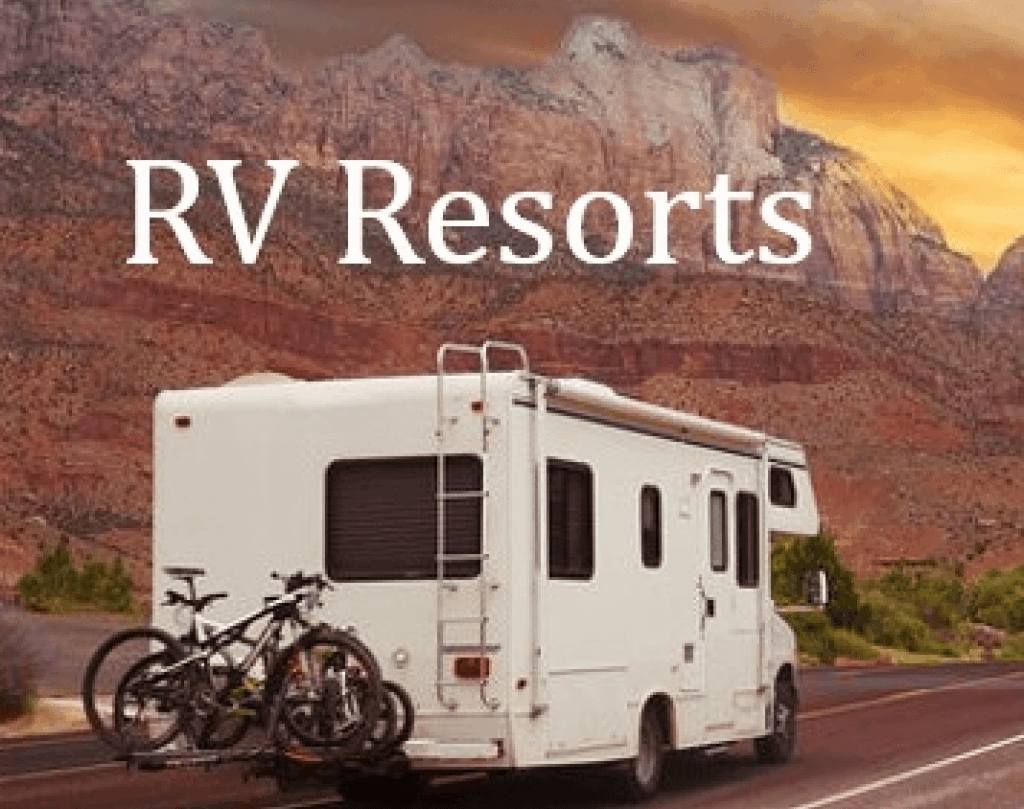 A recreational vehicle (RV) parked on a road with a picturesque backdrop of red rock cliffs at sunset. Bicycles are mounted on the back of the RV. The word 'RV Resorts' is prominently displayed at the top.