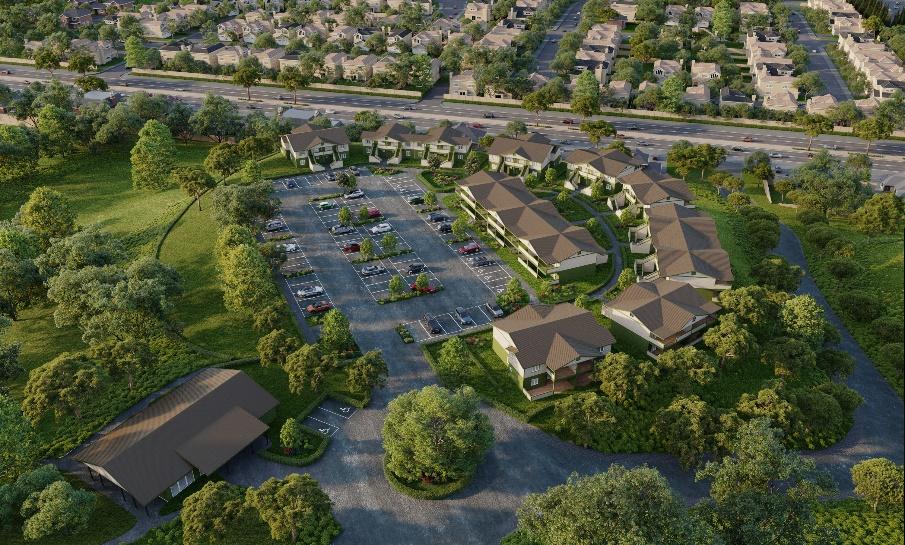 Aerial architectural rendering by Bernard Architects, featured in the Sage Outdoor Advisory Partner Spotlight. The rendering shows a multi-building development set among mature trees, with a large striped surface parking lot at the center. Two-story and three-story buildings with wide hipped roofs and covered balconies are arranged along the eastern edge of the site, with a row of smaller townhome-style buildings to the north. A separate open-sided pavilion structure sits at the lower left, connected by a curving drive. A multi-lane road and existing residential neighborhood are visible along the top of the frame.